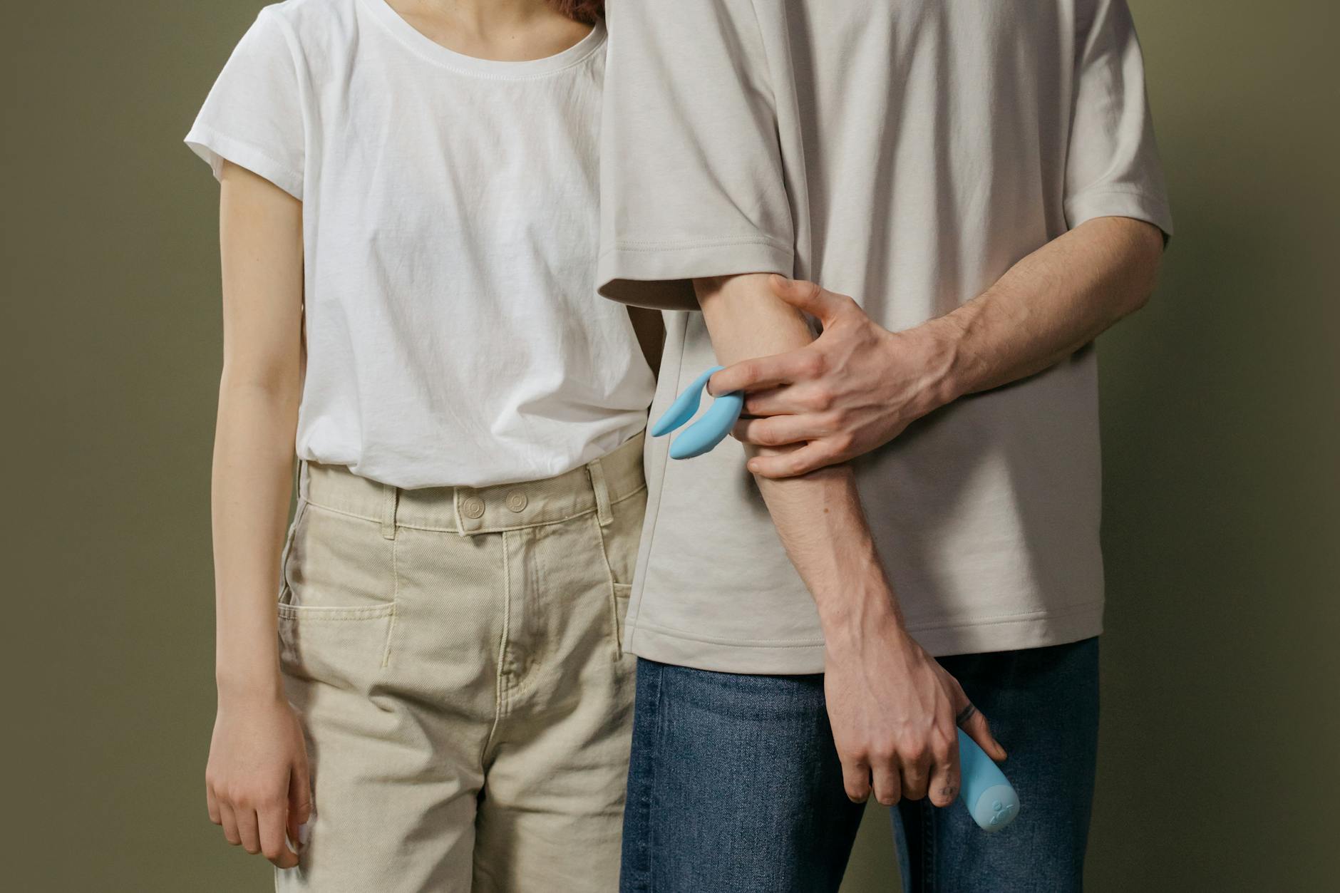 A couple holding a lemon vibrator together, representing modern intimacy and shared pleasure